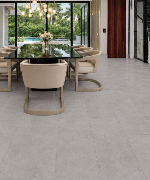 Bright Stone TechSlate flooring in a dining room with cream chairs and a black table.