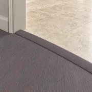 Ashen Chestnut T-molding transition — installed view