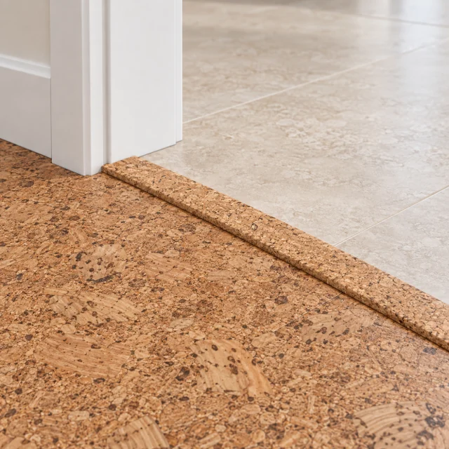 Autumn Leaves T-molding transition — installed view with product profile inset