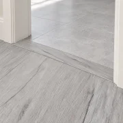 Light Grey Oak T-molding transition — installed view