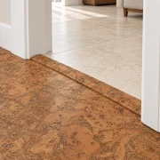 Tasmanian Burl T-molding transition — installed view