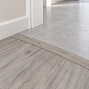 Wild Oak T-molding transition — installed view