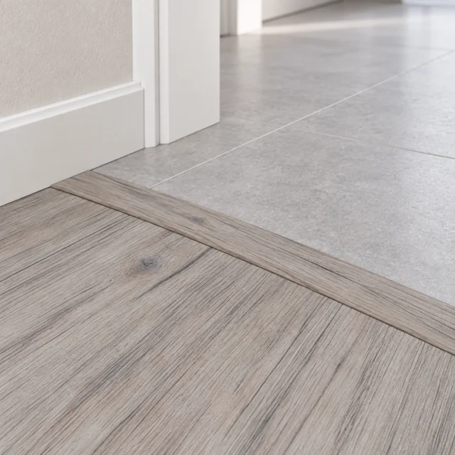 Wild Oak T-molding transition — installed view with product profile inset