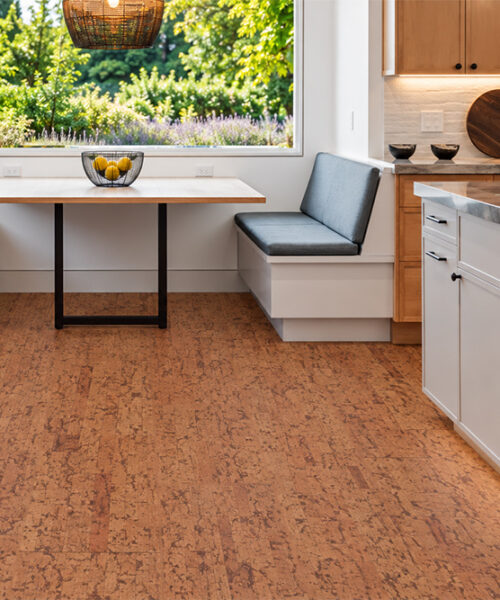 Amber Streak Amber-Brown Natural Cork Floor Planks Feature Streaked Texture In A Sunny Kitchen Breakfast Nook.