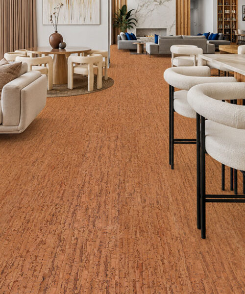 Amber Streak 12mm cork floating flooring installed in a modern open-concept living room and kitchen with warm natural cork texture.