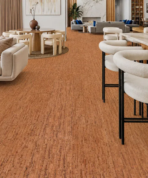 Amber Streak 12mm cork floating flooring installed in a modern open-concept living room and kitchen with warm natural cork texture.