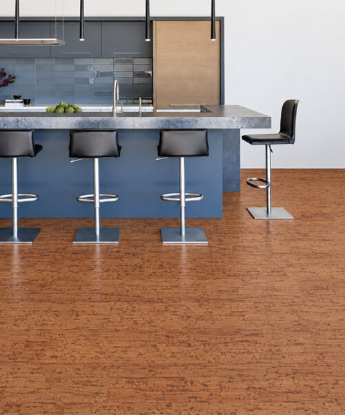Amber Streak Medium-Brown Cork Flooring With Natural Streaked Texture Complements A Modern Kitchen And Marble Island.