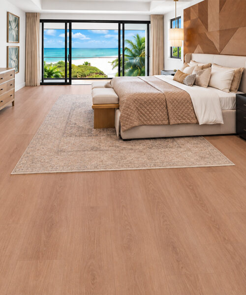 Medium-Brown American Red Oak Floating Cork Flooring Frames An Ocean-View Bedroom With A Wood Accent Wall.