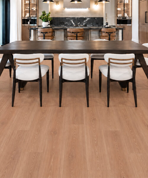 American Red Oak Floating Cork Planks Extend Across An Open Dining Area With White Chairs And Marble Bar.