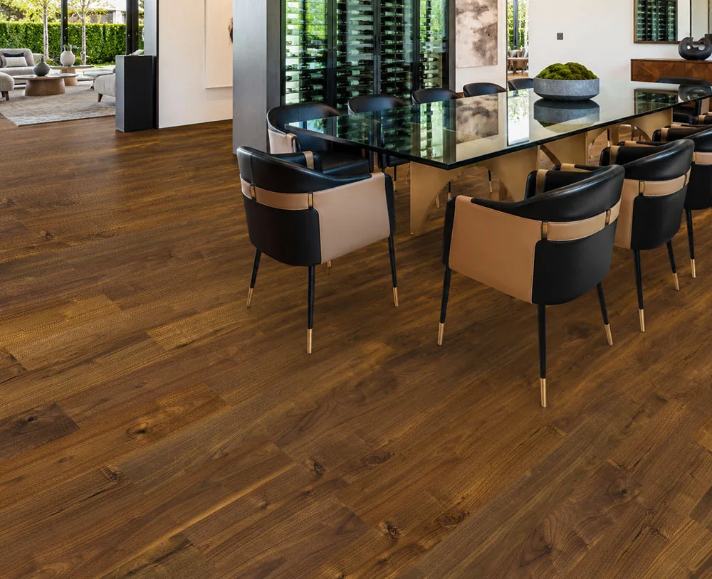 Ashen Chestnut - 7/16&Quot; (11Mm) - Swiss Design Cork Floating (Fascnut11) Ashen Chestnut Swiss Design Cork Floating Flooring In A Modern Dining Room With Rich Brown Wood-Look Planks.
