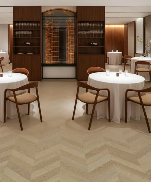 Elegant Aurora Chevron cork flooring in a modern restaurant – warm tone, acoustic comfort, and refined chevron pattern.