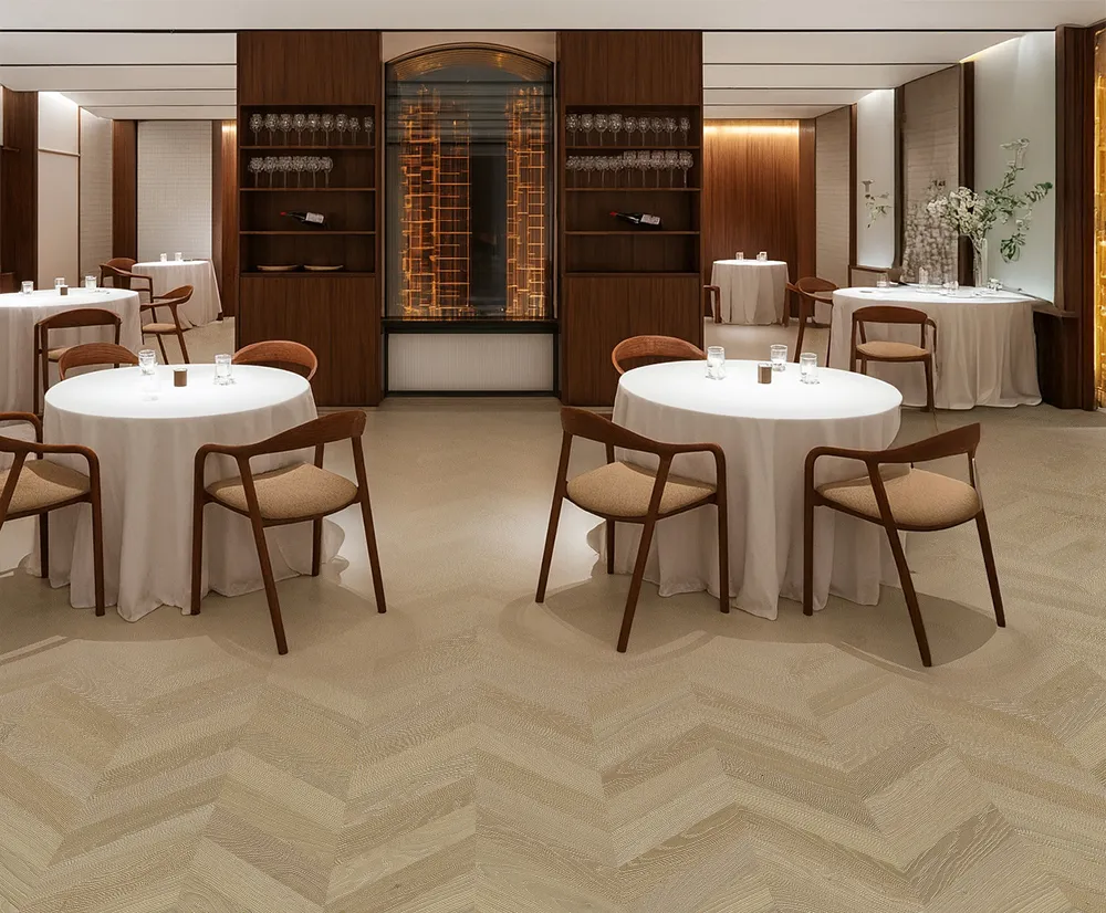 Elegant Aurora Chevron Cork Flooring In A Modern Restaurant – Warm Tone, Acoustic Comfort, And Refined Chevron Pattern.