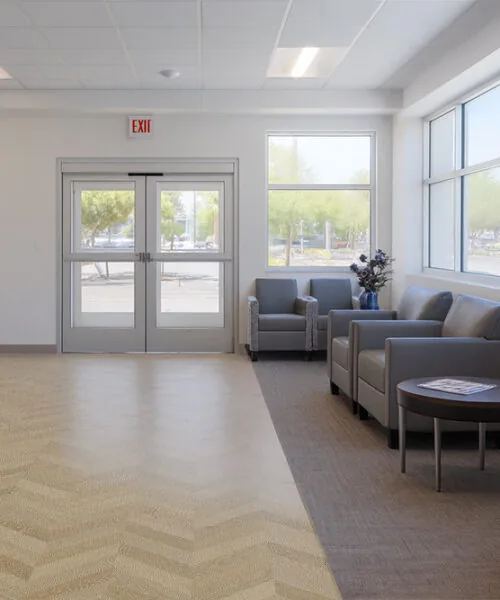 Aurora Chevron - 7/16″ (11Mm) - Swiss Design Cork Floating (Fauro11) Aurora Chevron Cork Flooring In A Bright Waiting Area – Antimicrobial, Easy-To-Clean, And Noise-Reducing Flooring Solution.