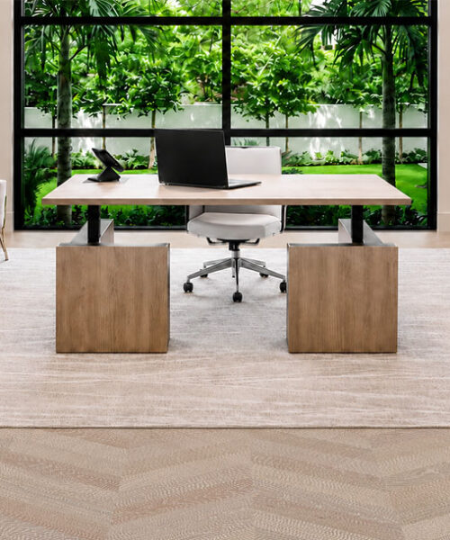 Aurora Chevron Cork Flooring For An Office Surrounds A Wood Desk, Built-In Cabinets, And Garden-Facing Windows.