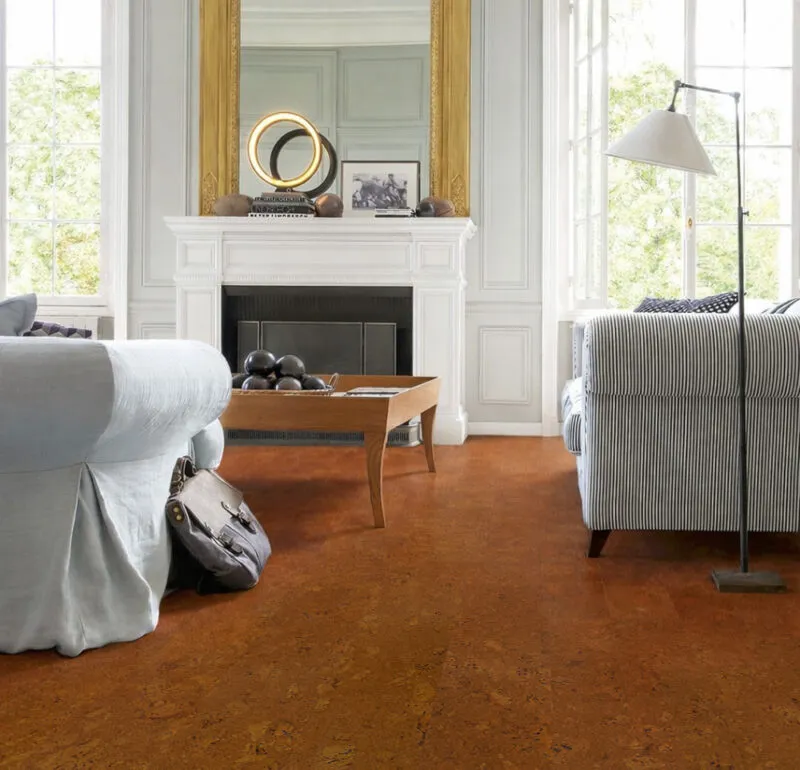 Autumn Ripple Cork Flooring In A Classic Living Room With Fireplace, Soft Seating, And Warm Natural Tones