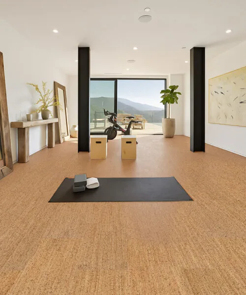 Berber cork flooring in a home yoga studio with natural light—soft, quiet, and resilient surface ideal for workouts.