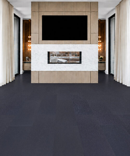 Black Buffalo Swiss Real Leather Flooring In A Luxury Living Space With Matte Black Planks, Marble Fireplace, Wood Media Wall And Floor-To-Ceiling Windows.