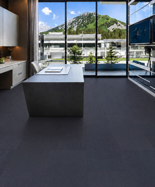 Black Buffalo Swiss Leather Flooring In A Luxury Modern Kitchen With Dark Wide Planks, Minimalist Cabinetry, Large Windows And Mountain Views.