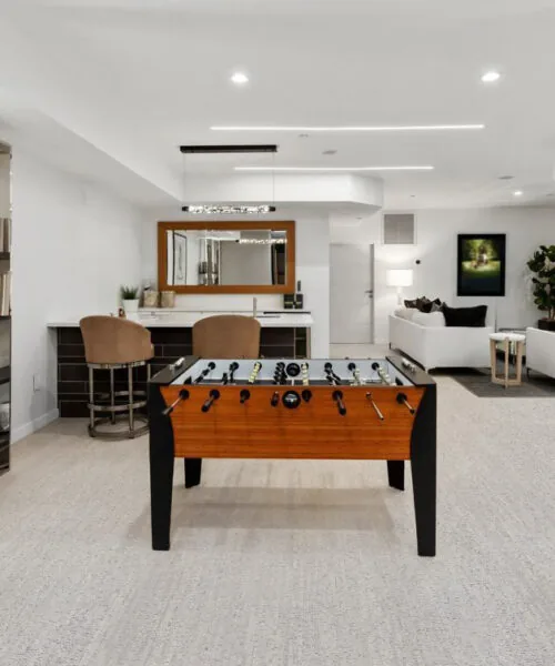 Bleached Birch Cork Entertainment Haven Basement With Foosball Bar White Sofa Set