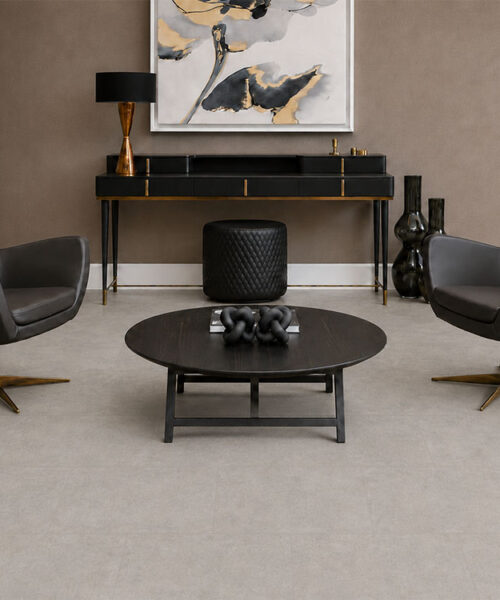Bris Stone Light Gray Floating Cork Flooring Anchors A Contemporary Sitting Room With Black Leather Chairs.