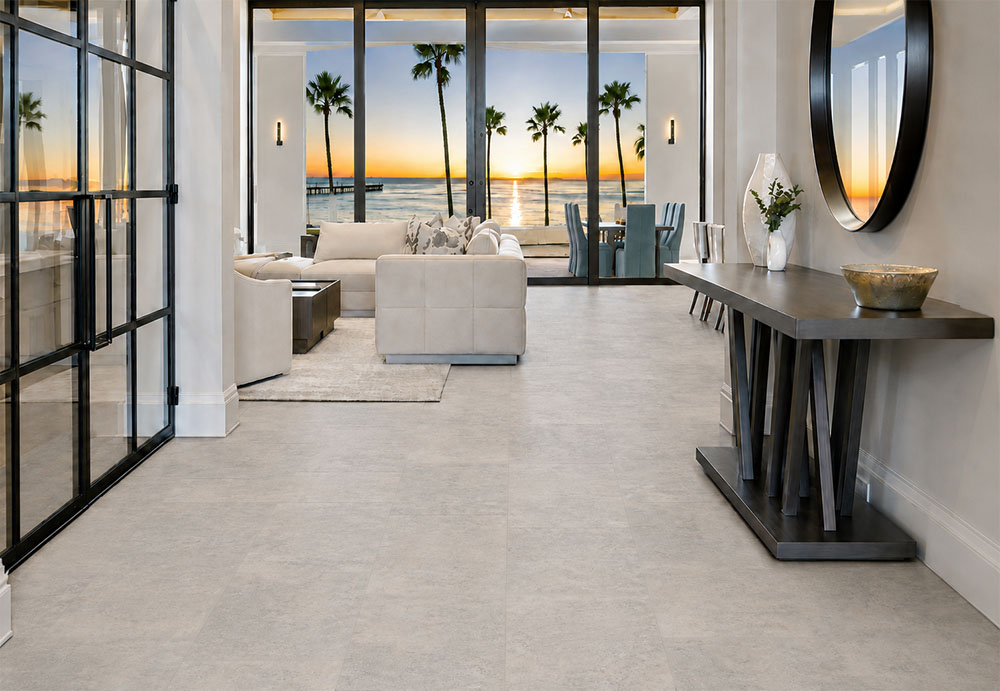 Warm Stone - 7/16&Quot; (11Mm) - Swiss Design Cork Floating (Fwmst11) Bris Stone Gray-Beige Floating Cork Flooring Leads Through An Entryway With A Console Table And Sunset Views.