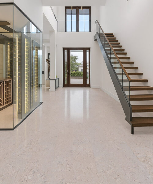 Ceramic marble cork flooring in contemporary living room with waterfront view and natural light