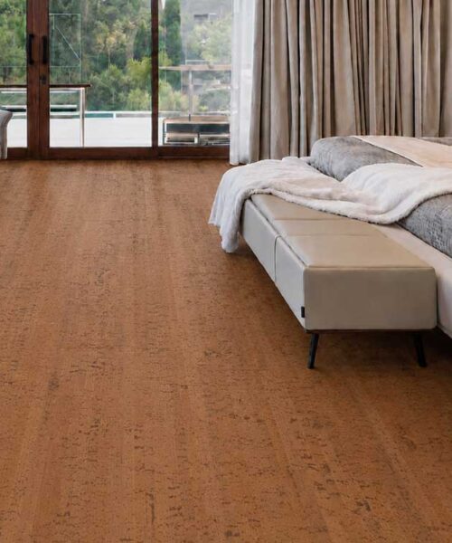 Cherry Line - 7/16&Quot; (11Mm) - Swiss Real Cork Floating (Fchl11) Cherry Line Reddish-Brown Cork Floor Planks In A Modern Bedroom With An Upholstered Bed And Armchair.
