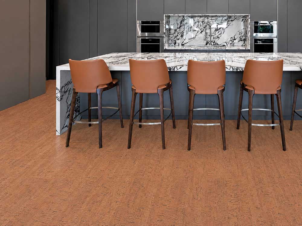 Cherry Line - 7/16&Quot; (11Mm) - Swiss Real Cork Floating (Fchl11) Cherry Line Floating Cork Flooring In A Contemporary Kitchen With A Marble Island And Leather Bar Stools.