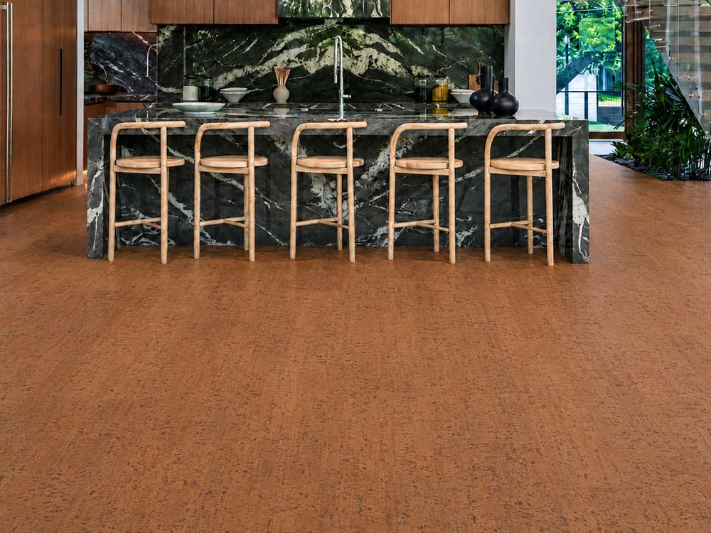 Cherry Line - 7/16&Quot; (11Mm) - Swiss Real Cork Floating (Fchl11) Cherry Line Natural Cork Flooring In A Modern Kitchen With A Dark Marble Island And Wood Stools.