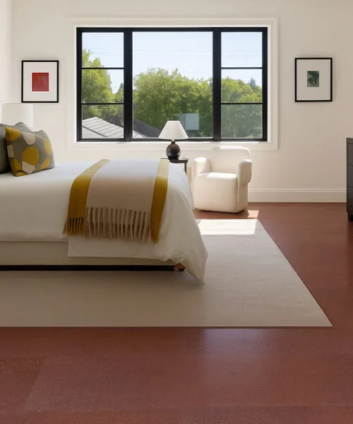 Chestnut – 3/8” (9.5Mm) – Swiss Leather Flooring (Lchsnt9.5) Chestnut Swiss Leather Flooring In A Modern Bedroom With White Bed And Yellow Throw Blanket