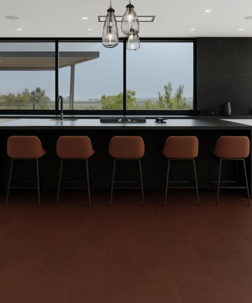 Chestnut Swiss Leather Flooring In A Modern Kitchen With Black Island And Brown Bar Stools