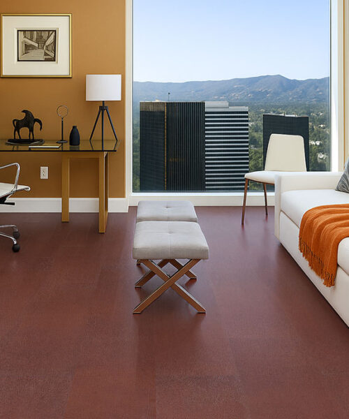 chestnut swiss leather flooring in a lounge room with white sofa orange throw and city view