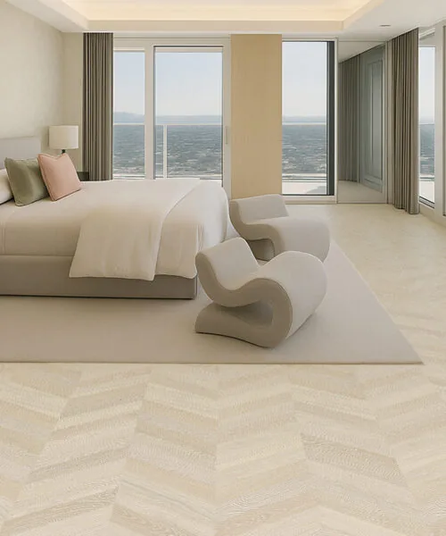 Cean-View Bedroom With Minimalist Décor And Clara Chevron Cork Floating Flooring In A Pale Chevron Design.