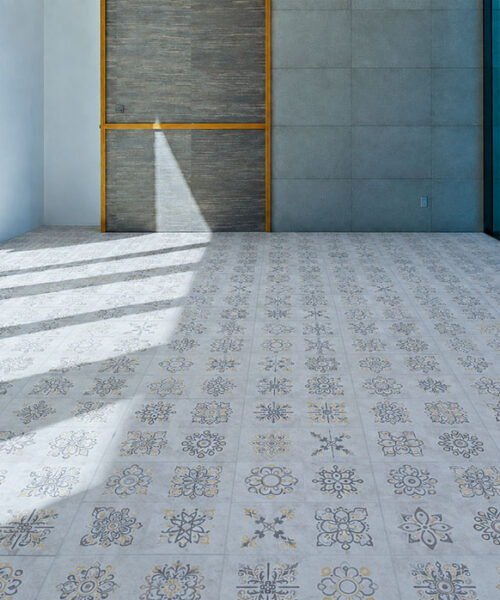 Light Gray Classic Porcelain Swiss Techslate Contemporary Architectural Flooring Features Repeating Floral Motifs In A Sunlit Modern Interior.