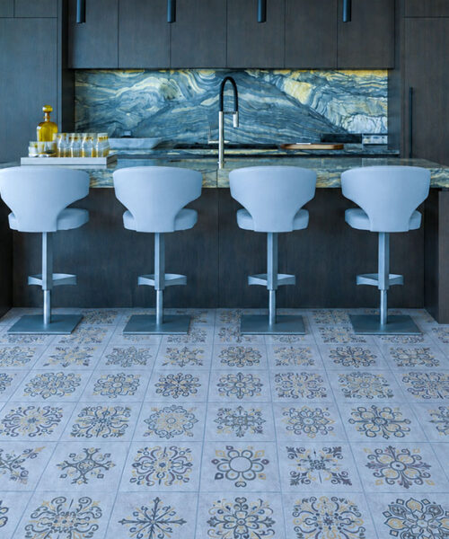 Classic Porcelain Swiss Techslate Click-Lock Flooring In Light Gray Extends Across A Contemporary Kitchen With Natural Light And Island Seating.