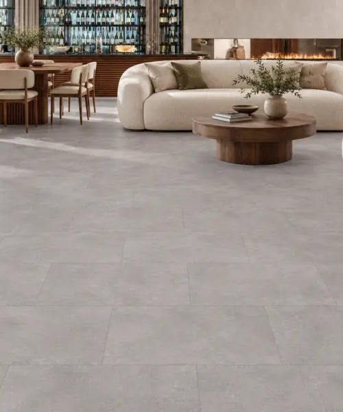 Copperstone Gray installed flooring in a furnished daylight interior; accurate product scale visualization (NCopG9.5)