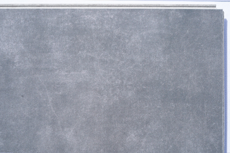Concrete Alloy - 19/64&Quot; (7.5Mm) - Swiss Techslate (Mcona7.5) Concrete Alloy Swiss Techslate Flooring Featuring A Modern Gray Concrete Appearance With Subtle Industrial Texture And A Contemporary Cement-Look Surface.