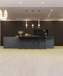 Contemporary Kitchen With Matte Black Cabinets, Pendant Lighting, And Vertical Swiss Cork Flooring Offering Comfort, Noise Reduction, And Eco-Friendly Design