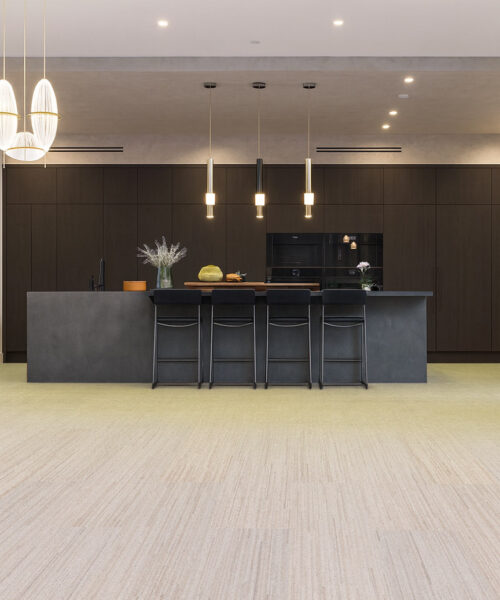 Vertical - 7/16&Quot; (11Mm) - Swiss Real Cork Floating (Fvtc11) Contemporary Kitchen With Matte Black Cabinets, Pendant Lighting, And Vertical Swiss Cork Flooring Offering Comfort, Noise Reduction, And Eco-Friendly Design