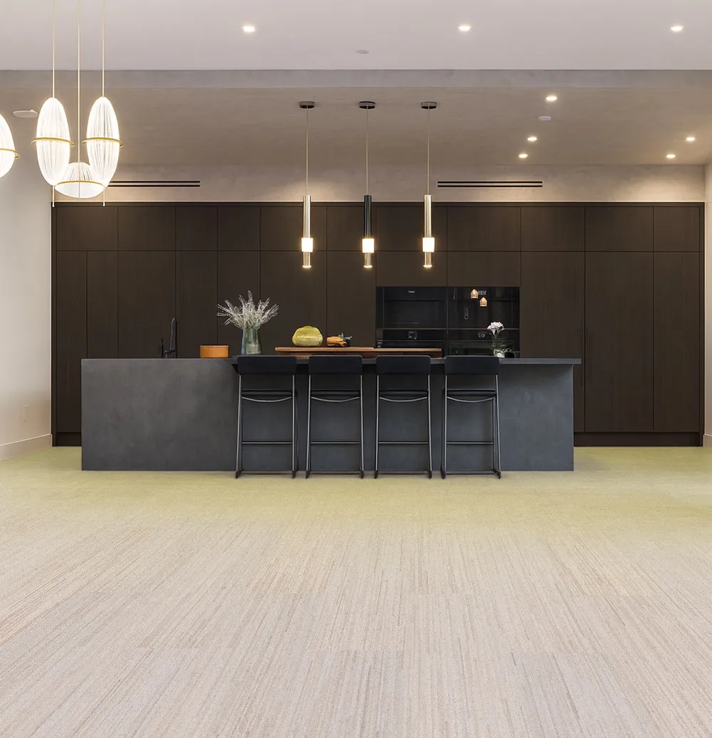 Vertical - 7/16&Quot; (11Mm) - Swiss Real Cork Floating (Fvtc11) Contemporary Kitchen With Matte Black Cabinets, Pendant Lighting, And Vertical Swiss Cork Flooring Offering Comfort, Noise Reduction, And Eco-Friendly Design