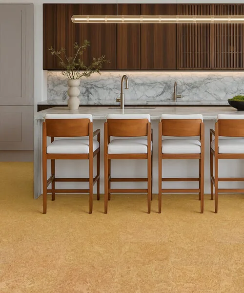 Desert Arable - 25/64&Quot; (10Mm) - Cork Floating (Fda10) Luxury Kitchen With Marble Waterfall Island, Wood Slat Cabinets, And Bright Desert Arable Cork Flooring.