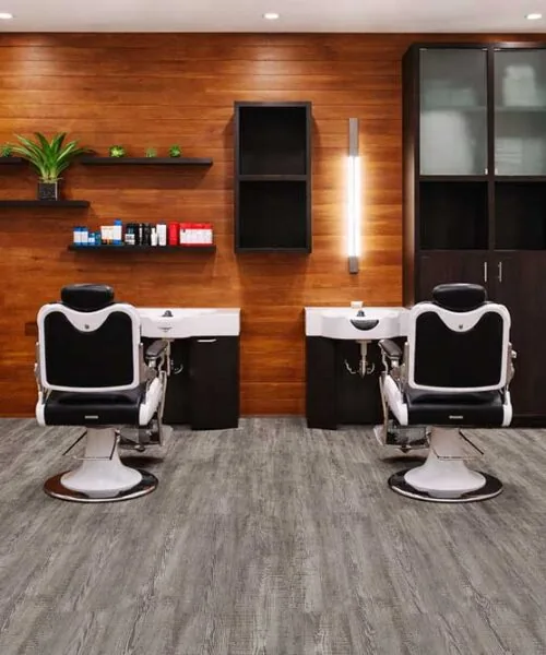 Salon interior with Earthy Pine Forna Natural Composite waterproof flooring, ideal for commercial and high traffic environments.
