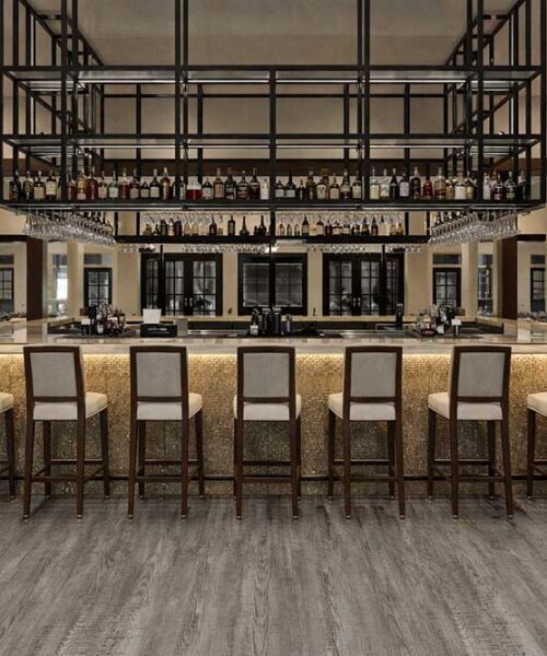 Earthy Pine Waterproof Commercial Linoleum Flooring In A High-End Bar And Lounge Interior.