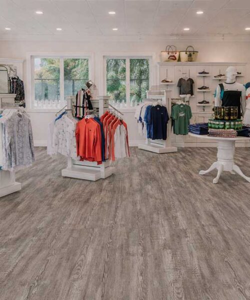 Retail Clothing Store Featuring Earthy Pine Swiss Real Linoleum Waterproof Commercial Flooring.