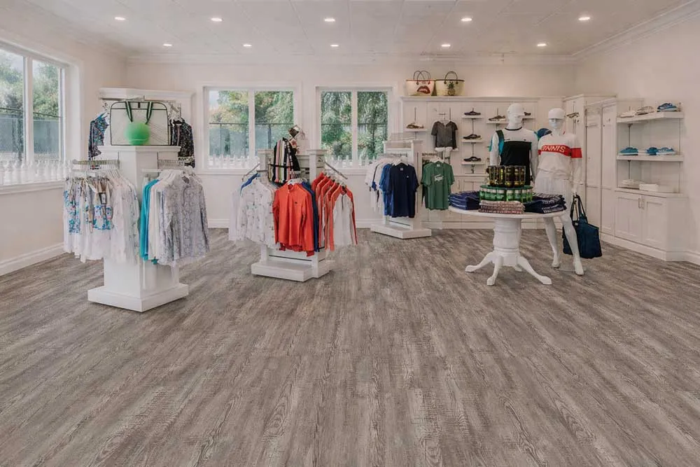 Retail Clothing Store Featuring Earthy Pine Swiss Real Linoleum Waterproof Commercial Flooring.