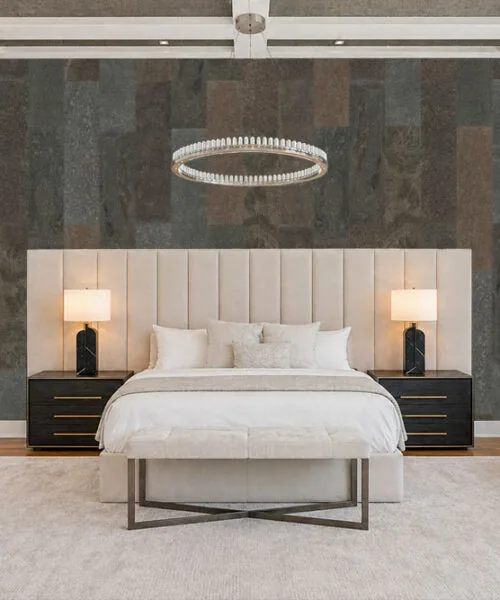 Gold Mica Slate real stone tiles used as a bedroom accent wall adding natural texture and warm tones behind upholstered bed