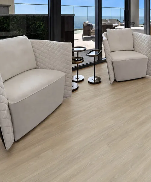 Hamilton - 7/16&Quot; (11Mm) - Swiss Design Cork Floating (Fham11) Hamilton Light Beige Wood-Look Cork Flooring In A Contemporary Living Room With White Lounge Chairs
