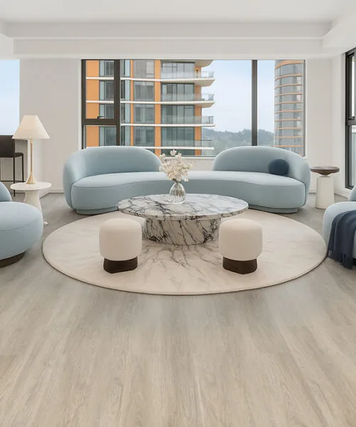 Hamilton - 7/16&Quot; (11Mm) - Swiss Design Cork Floating (Fham11) Modern Living Room Featuring Hamilton Swiss Cork Floating Flooring With Light Natural Wood Tones, Paired With Soft Blue Contemporary Furniture And Large Windows Showcasing A Bright Open Space