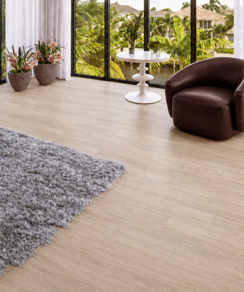 Hamilton - 7/16&Quot; (11Mm) - Swiss Design Cork Floating (Fham11) Hamilton Warm Gray Wood-Grain Cork Flooring In A Sunlit Sitting Room With Floor-To-Ceiling Windows