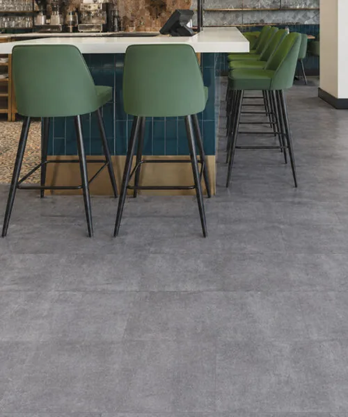 Industrial Grey - 3/8&Quot; (9.5Mm) - Forna Natural Composite Flooring With Waterproof Hydrowood Core (Nindg9.5) Durable Gray Concrete Look Flooring In A Stylish Restaurant Or Café Bar